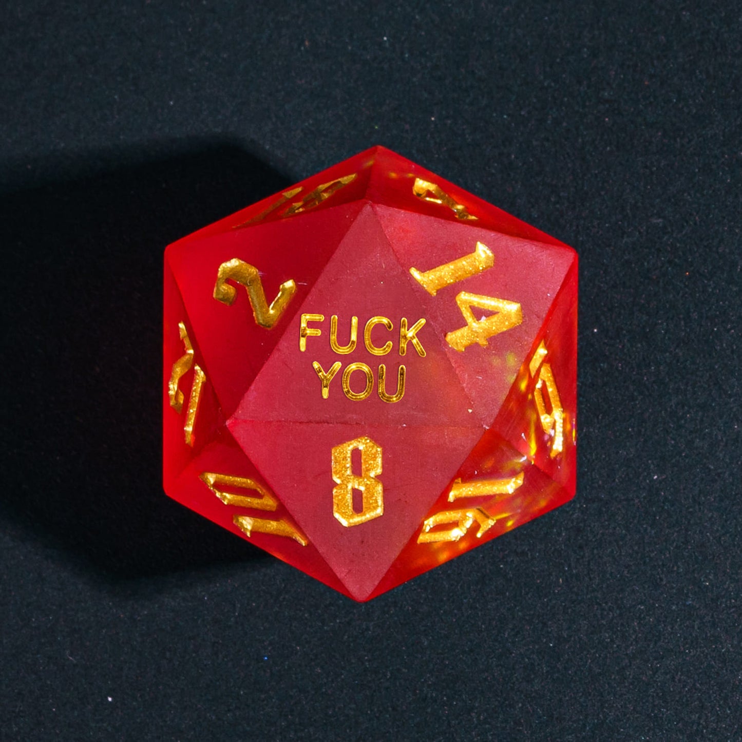 Close up of Frosted Ember Sharp Edge D20 with Fuck You face for DnD dice