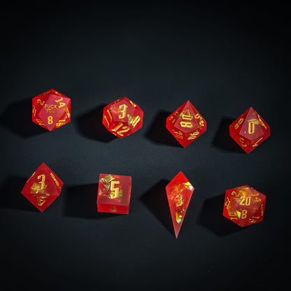 Flat lay of Frosted Ember Sharp Edge Dice Set 8 piece resin dice for DnD