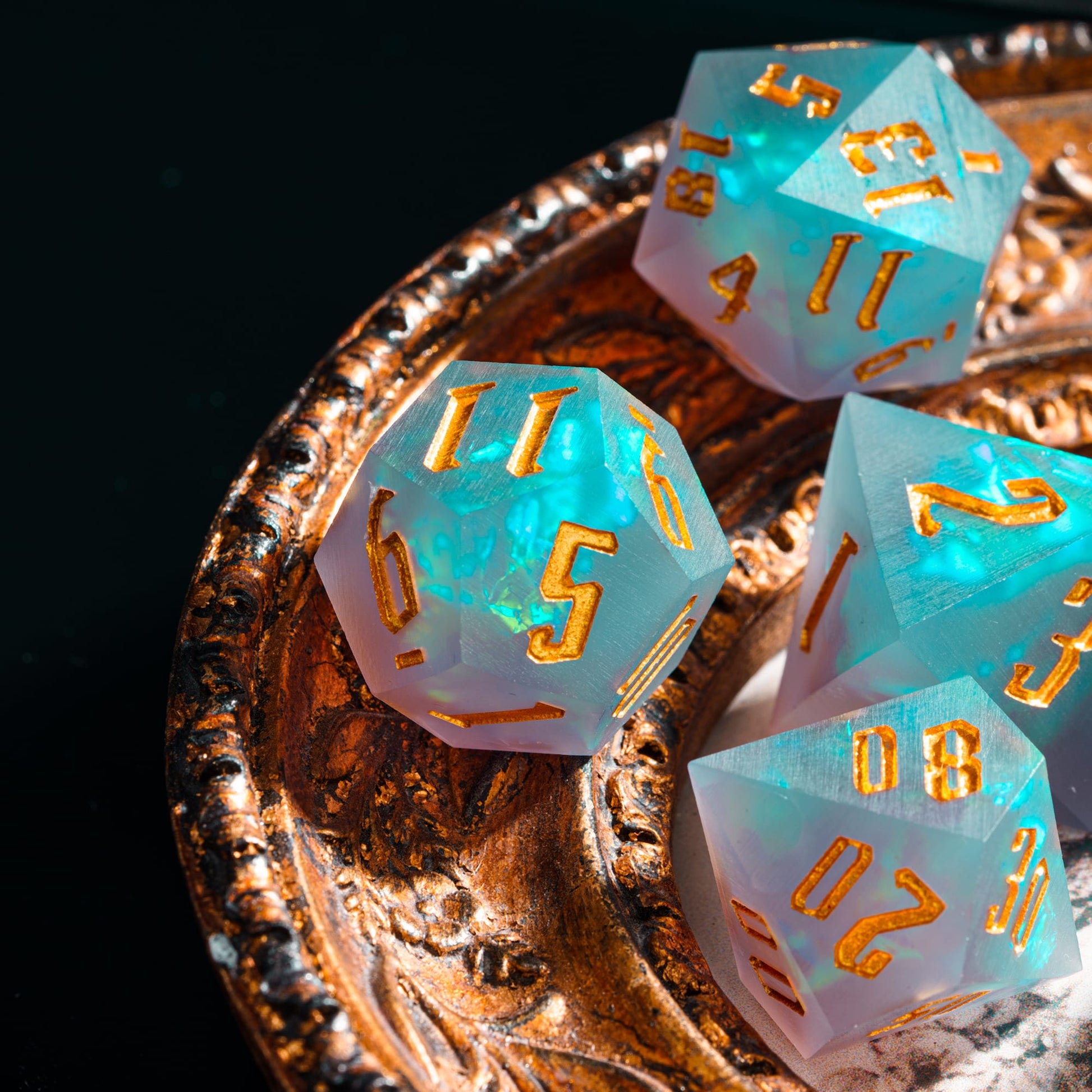 Frosted Mirage Sharp Edge Dice Set displayed on ornate tray with frosted resin & gold numbers