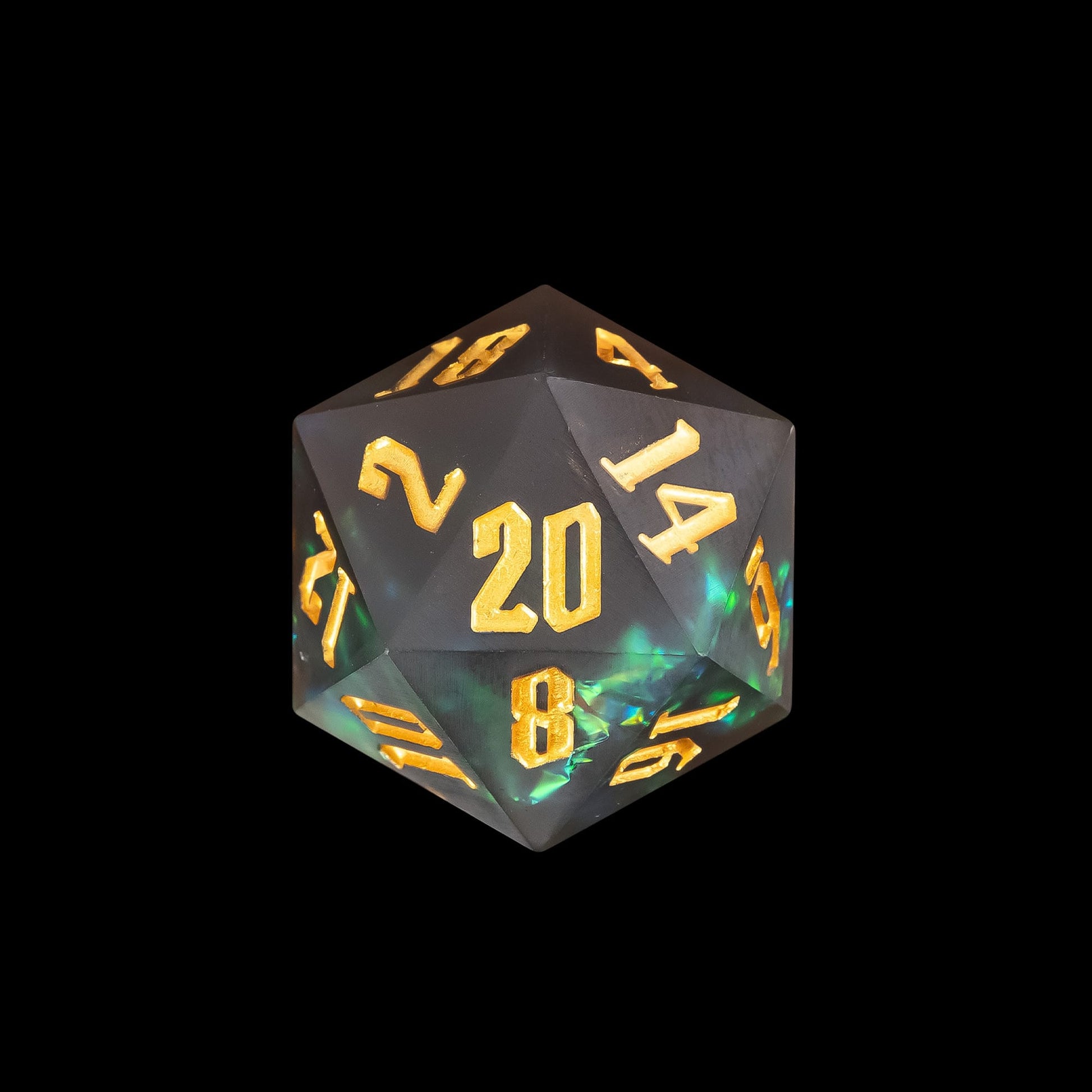 Close up of Frosted Mirage sharp edge D20 with frosted resin, green iridescent inclusions, and gold numbering