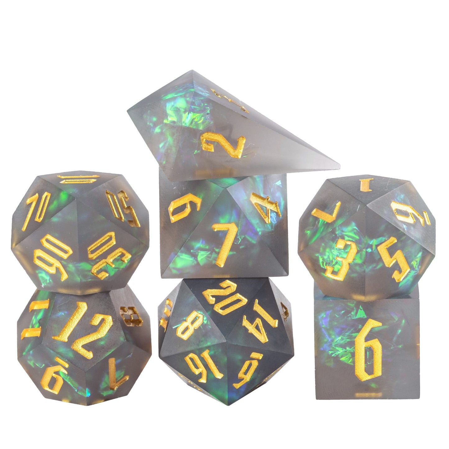 Frosted Mirage sharp edge dice set stacked in smoky grey resin with green shimmer and gold numbers