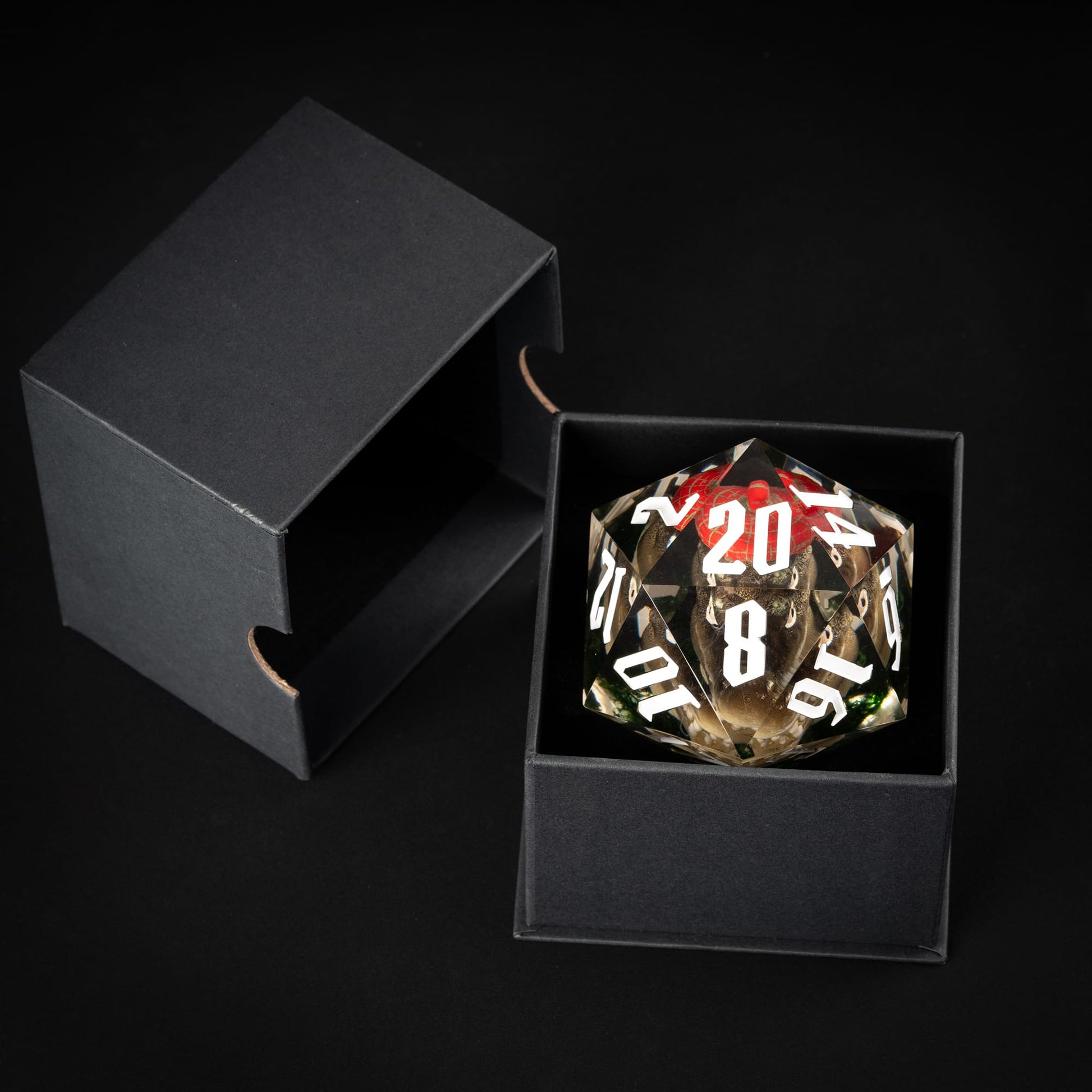 Red gator oversized D20 inside black presentation box