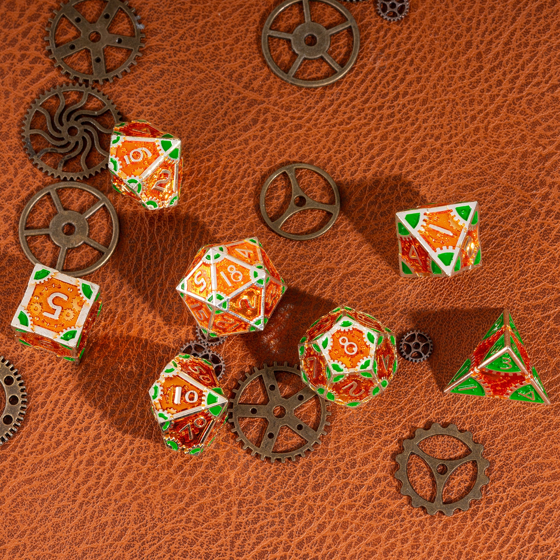 Flat lay of the Guillman's Guilded Metal Dice Set with decorative gears on a brown leather tabletop, highlighting all seven dice