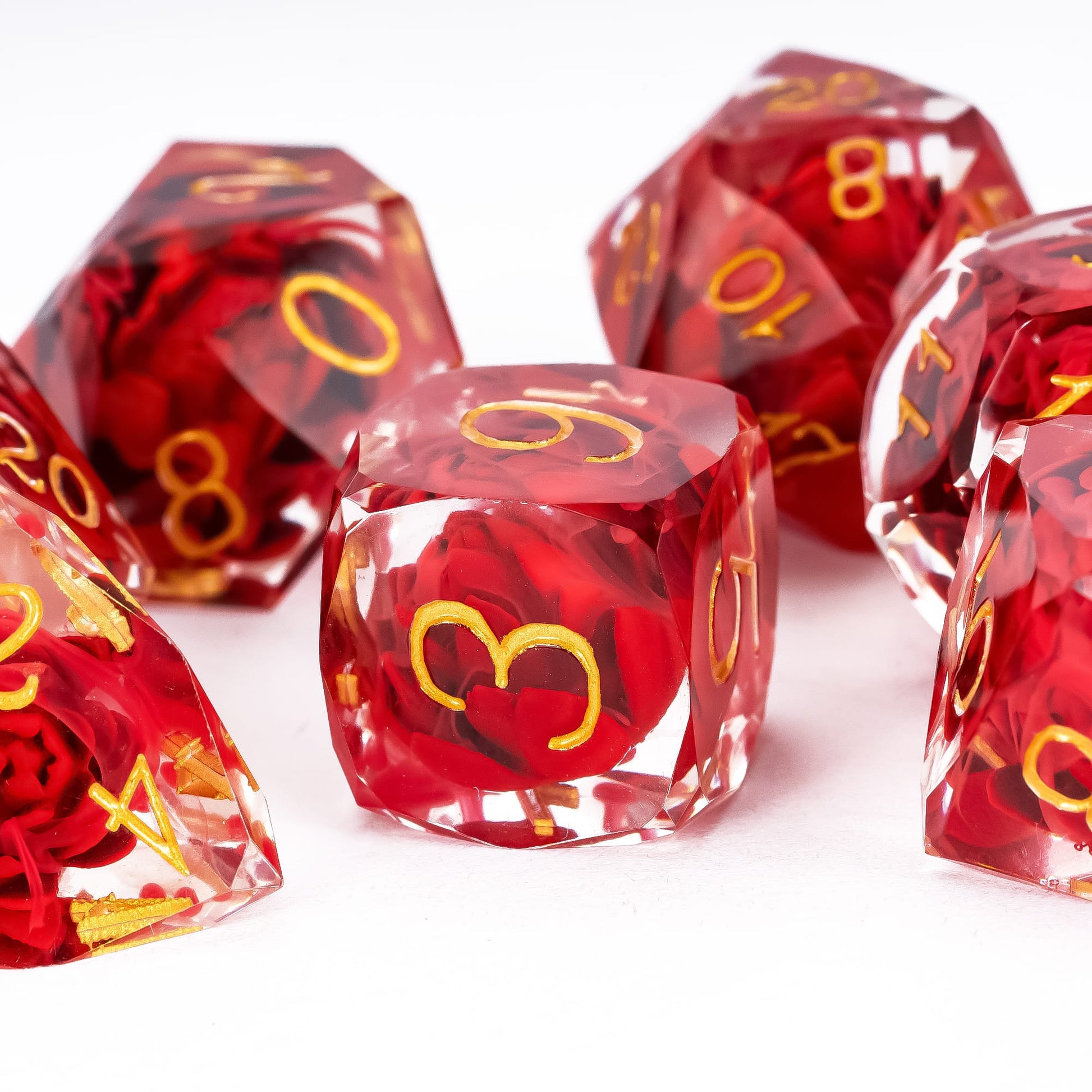Infernal Lotus Sharp Edge Dice Set D6 close-up featuring a suspended crimson lotus flower and gold numbering