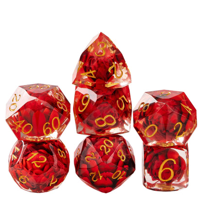 Infernal Lotus Sharp Edge Dice Set stacked display showcasing crimson lotus flower inclusions and gold numbering in sharp edge resin dice