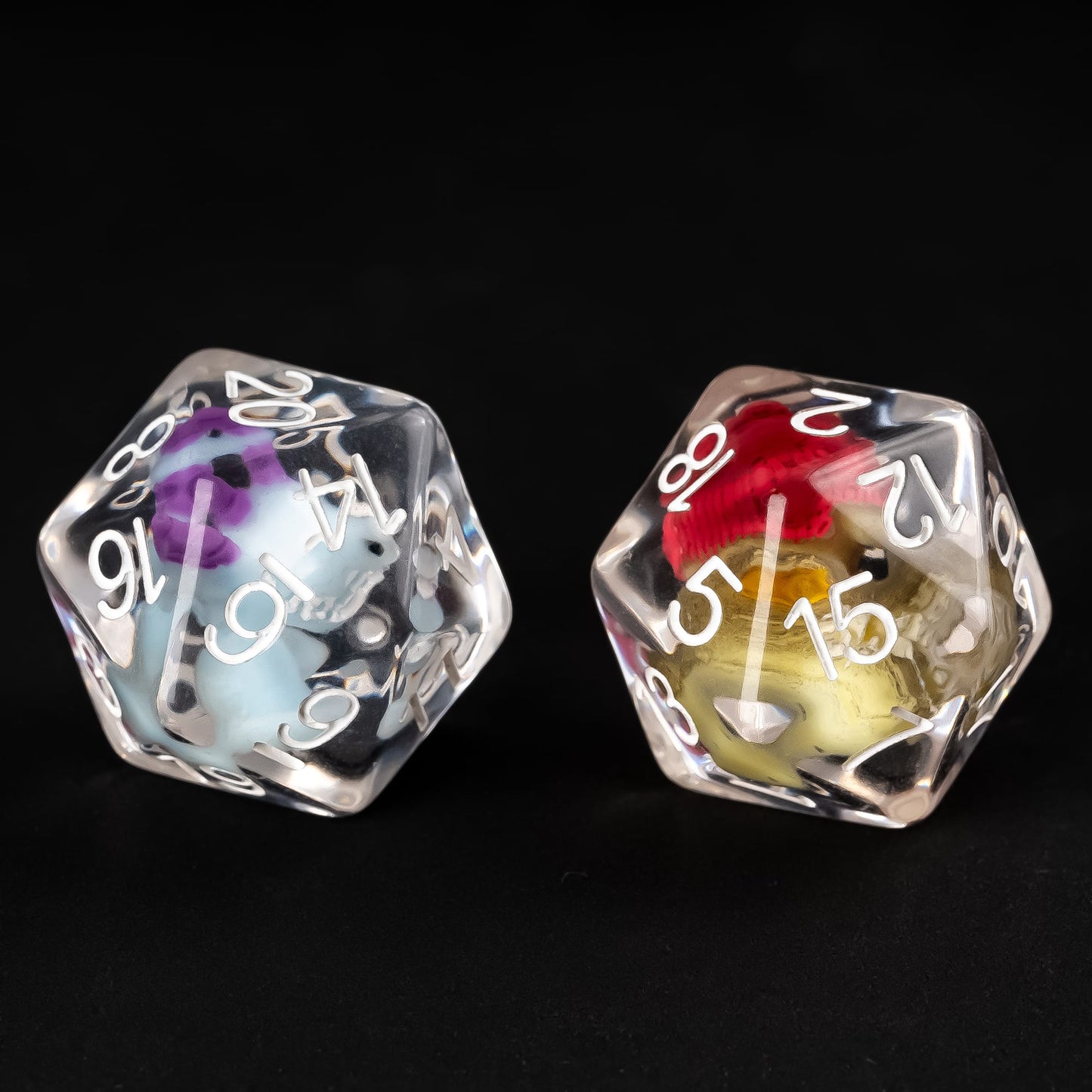 Kobold and Gator single D20 resin dice shown side by side in clear resin