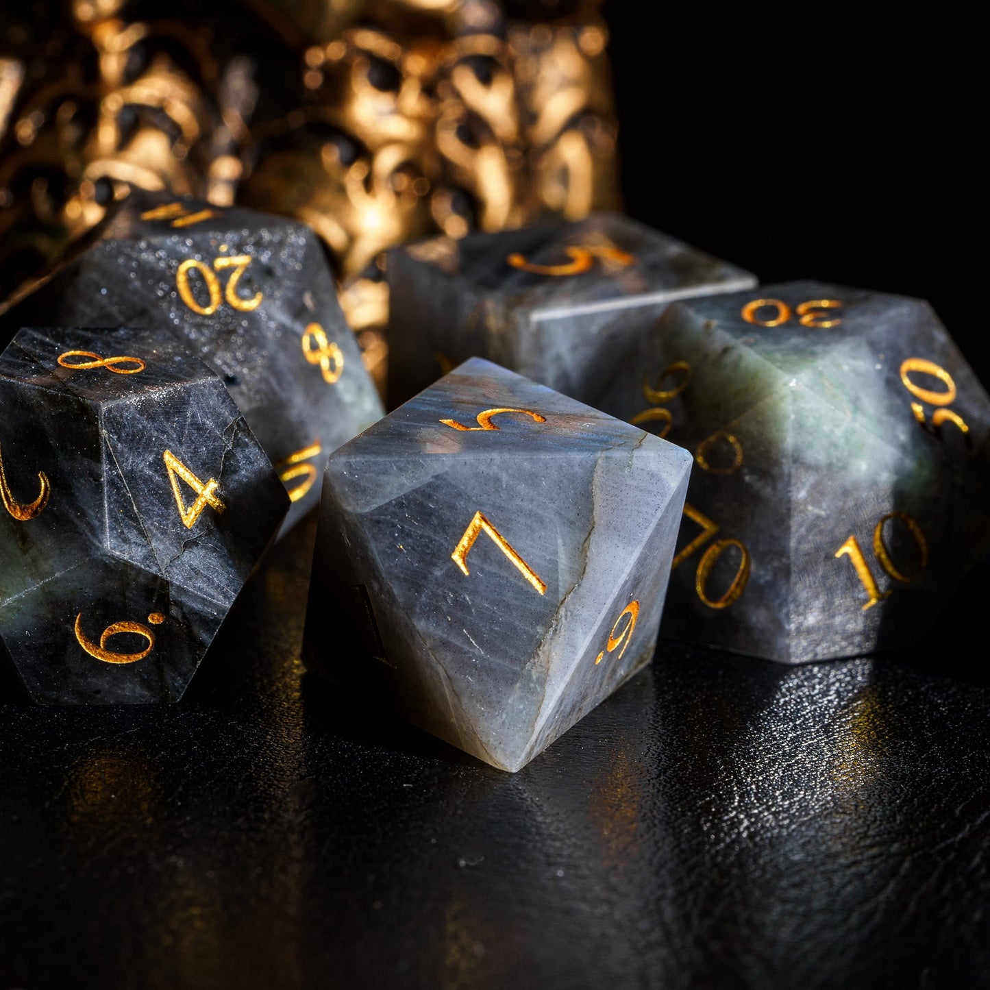 Labradorite Essence stone dice set arranged in display formation
