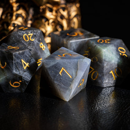 Labradorite Essence stone dice set arranged in display formation