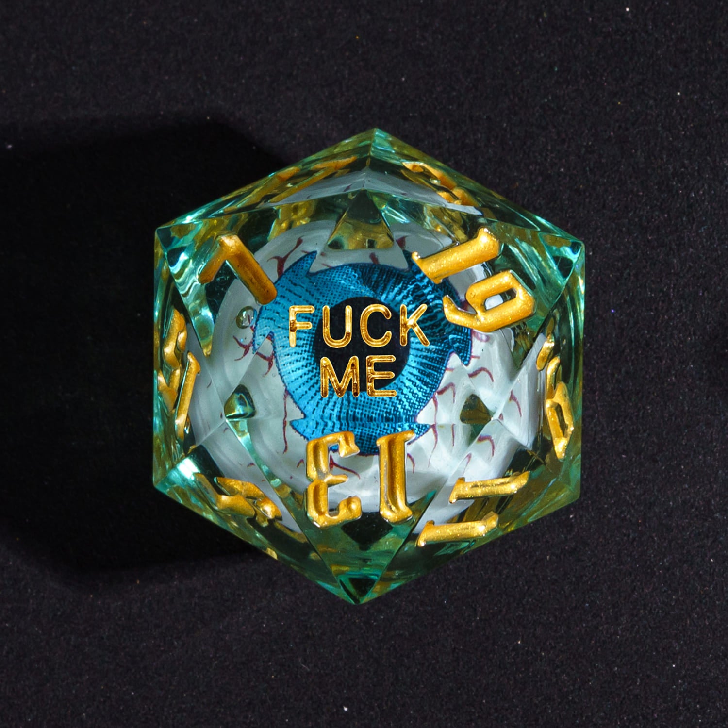 Close up of Liquid Core Eye Blue Fuck Me D20 Sharp Edge Die with blue eye core for DnD