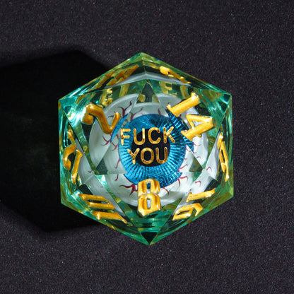 Close up of Liquid Core Eye Blue Fuck You D20 Sharp Edge Die with gold numbers for DnD
