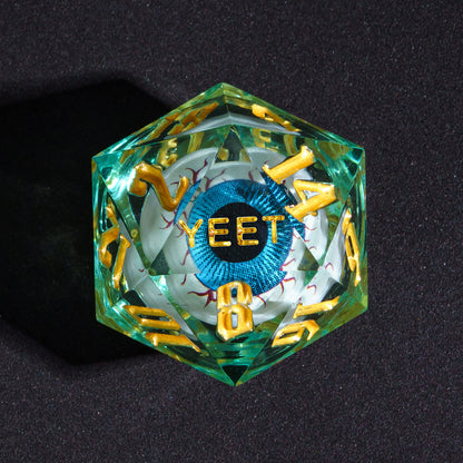 Close up of Liquid Core Eye Blue Yeet D20 Sharp Edge Die with gold numbering for DnD