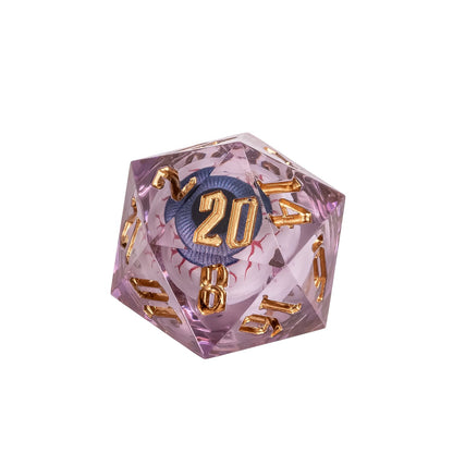 Close up of Liquid Core Eye Purple Sharp Edge D20 featuring suspended purple liquid eye core and metallic gold numbers