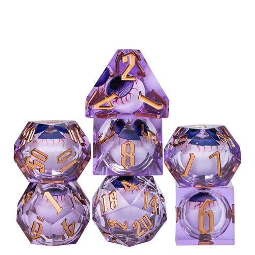 Stacked display of Liquid Core Eye Purple Sharp Edge Dice Set 7 piece translucent violet resin dice collection for DnD