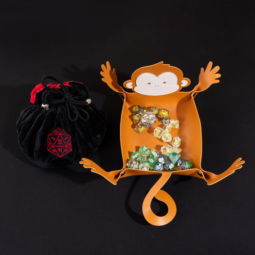 Little Friends Dice Bundle featuring a monkey-shaped dice tray, four drawstring dice bags, and a premium velvet dice bag for tabletop RPGs.