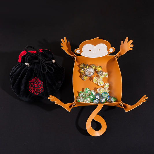 Little Friends Dice Bundle featuring a monkey-shaped dice tray, four drawstring dice bags, and a premium velvet dice bag for tabletop RPGs.