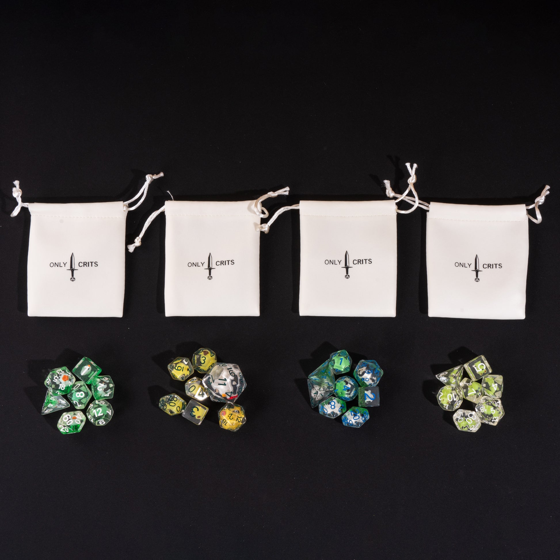 Little Friends Dice Bundle with four Only Crits drawstring dice bags, each paired with a colorful polyhedral dice set.