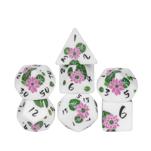 Stacked display of Lotus Blossom Dice Set with lotus flower artwork for DnD & DnD 5e