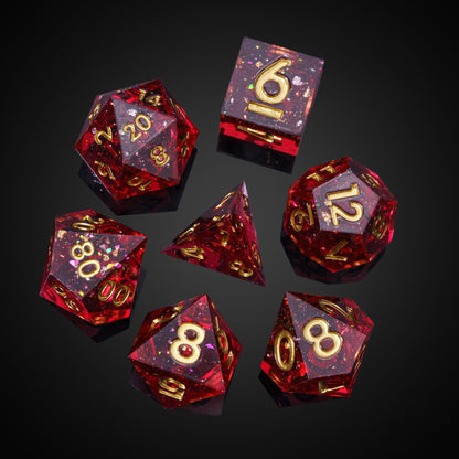 Magma Flake Sharp Edge Dice Set, 7 piece red resin dice with gold numbering arranged for DnD & DnD 5e