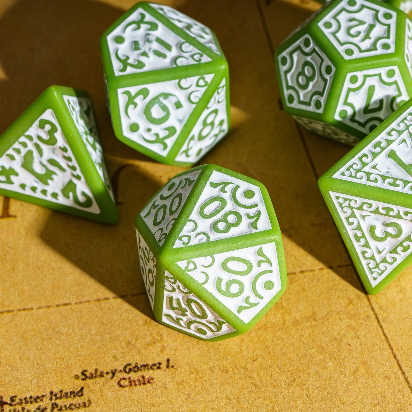 Green Medieval Majesty dice grouped together with ornate detailing