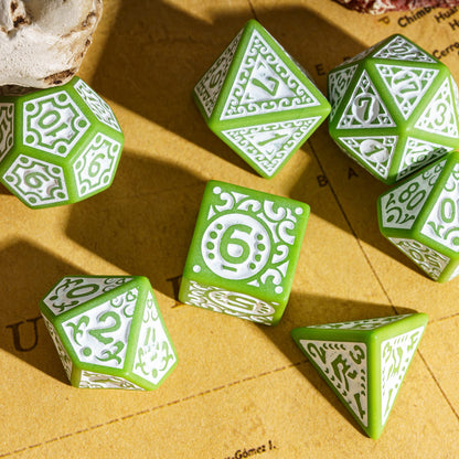 Green Medieval Majesty dice spread out on a map background, featuring decorative carvings