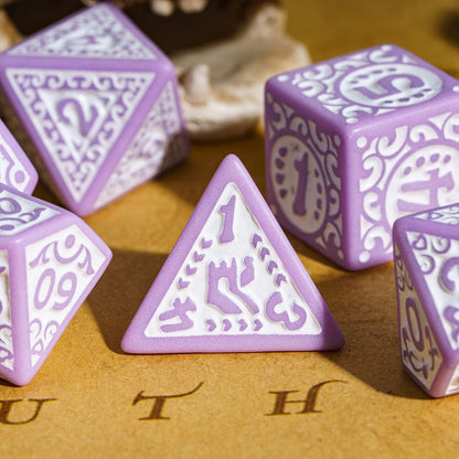 Close-up of purple Medieval Majesty d4 with white ornate engravings