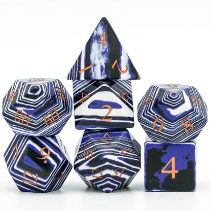 Midnight Tides Stone Dice Set stacked display with gemstone dice showing bold stripe patterns