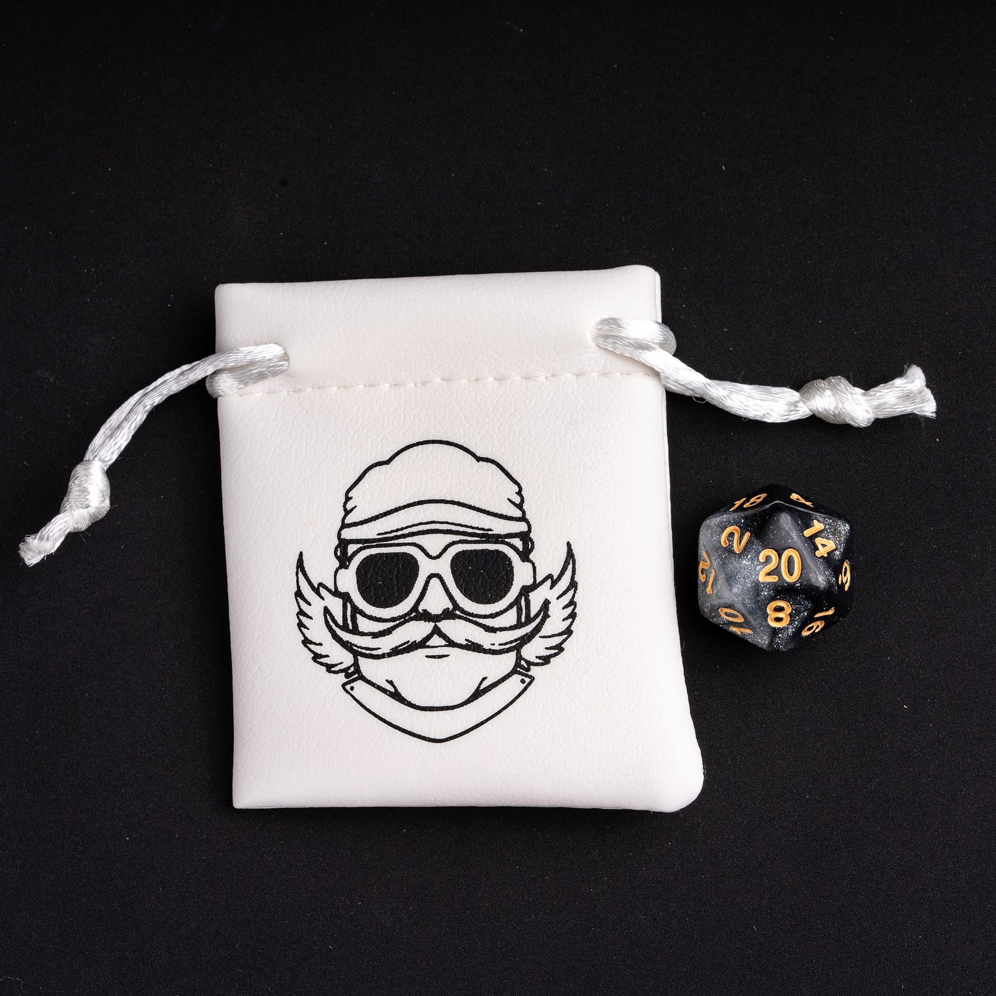 Black silver D20 die beside Only Crits logo white dice pouch