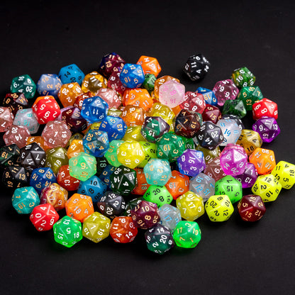 Assorted random D20 dice pile on black tabletop background