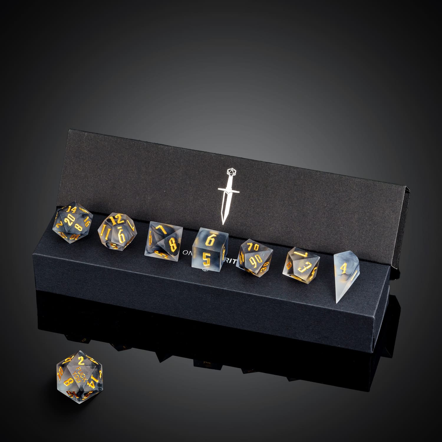 Nimbus Noir F*ck Me sharp edge dice set in black display box with full 7 dice visible