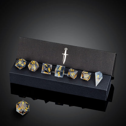 Nimbus Noir F*ck Me sharp edge dice set in black display box with full 7 dice visible