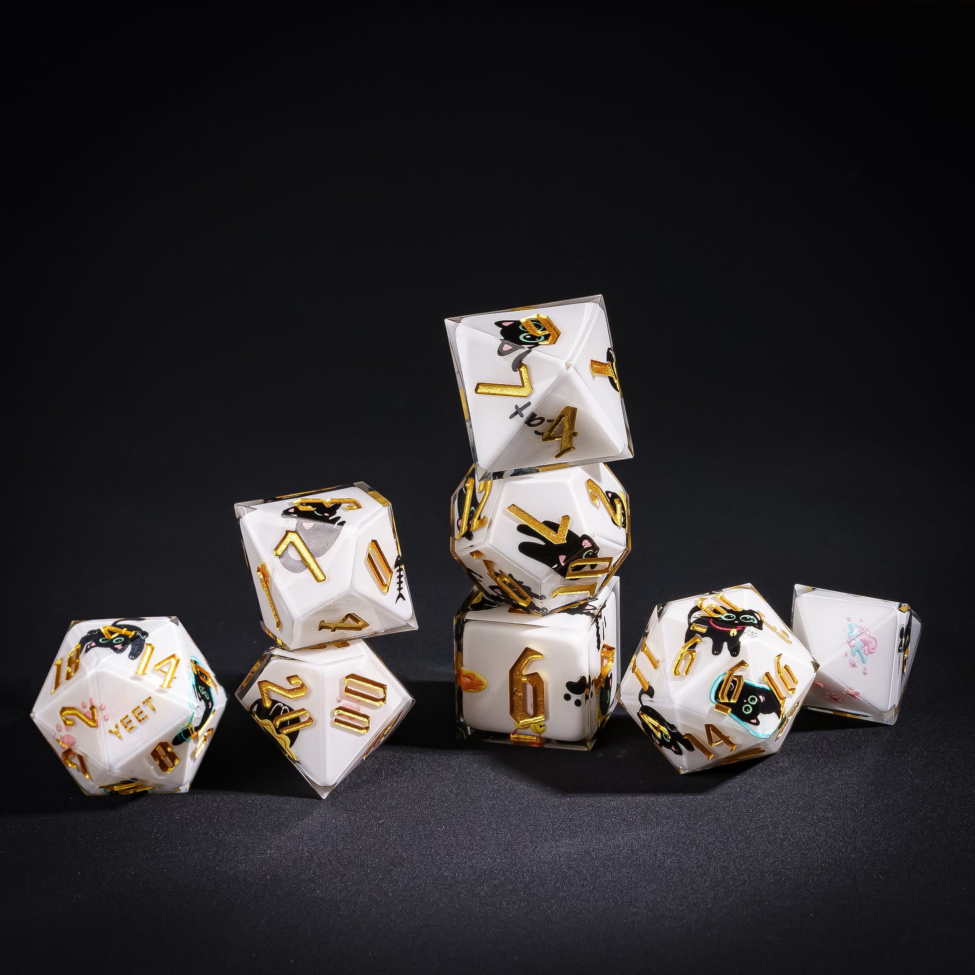 Stacked Nocturne Whiskers Yeet Sharp Edge Dice Set with black cat and gold numbering for DnD