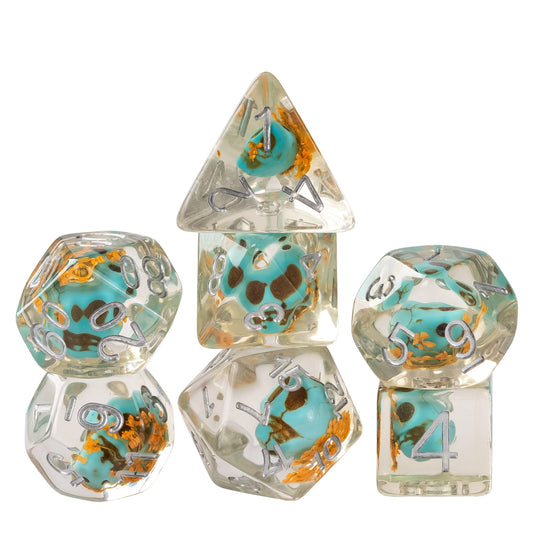 Ocean Wizards Phylactery Skull dice set featuring ocean-inspired skull inclusions and deep blue resin for DnD and tabletop RPGs