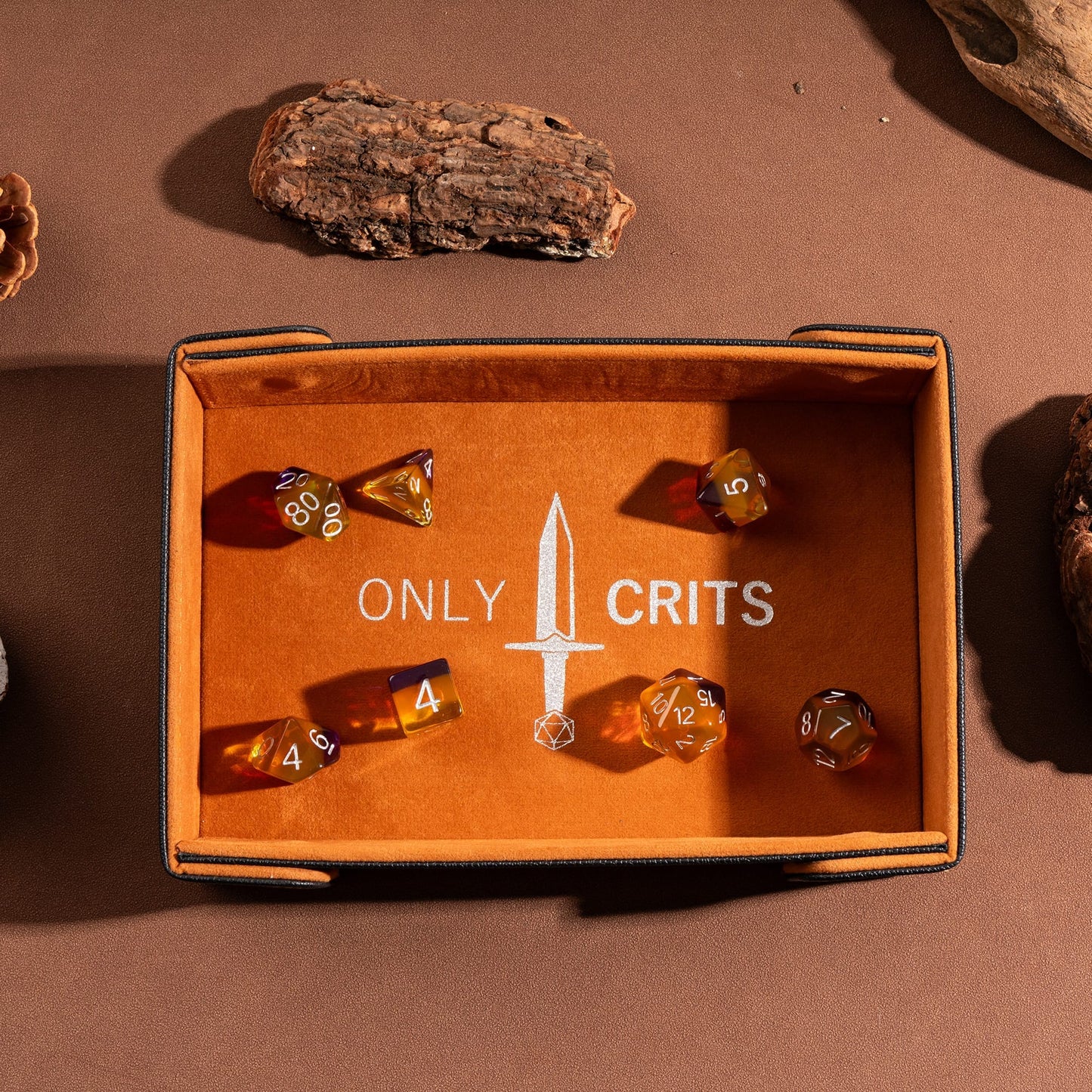 Only Crits Guildmaster Dice Tray in orange displaying a full RPG dice set on a soft protective lining