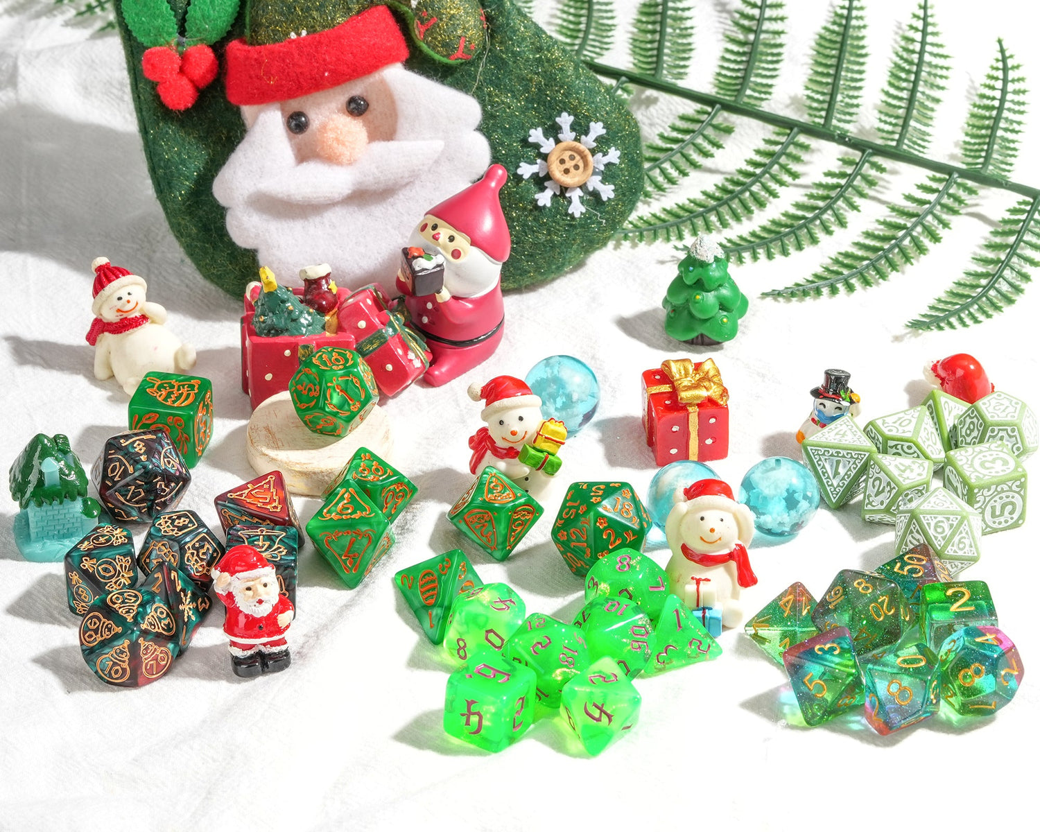 Collection of Christmas-themed dice and figurines with a Santa Claus stocking in the background.