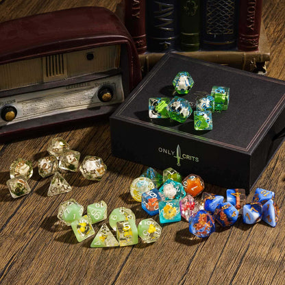 Assorted Only Crits resin dice sets displayed around black Mystery Box