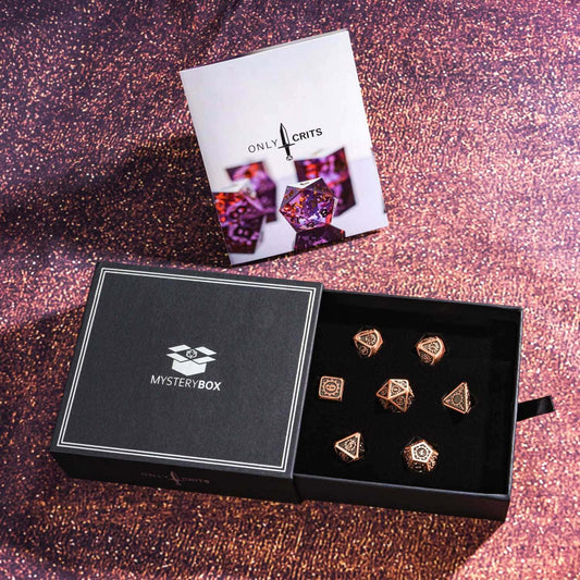 Open Only Crits Mystery Box with copper metal dice set on glitter background