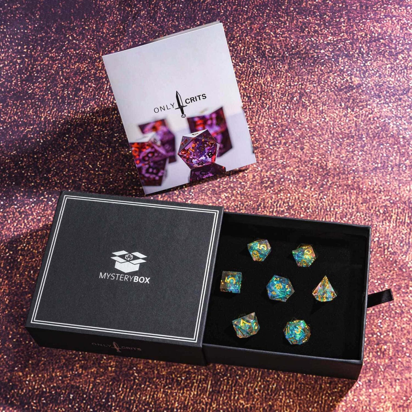 Only Crits Mystery Box open with sharp edge resin dice on purple background
