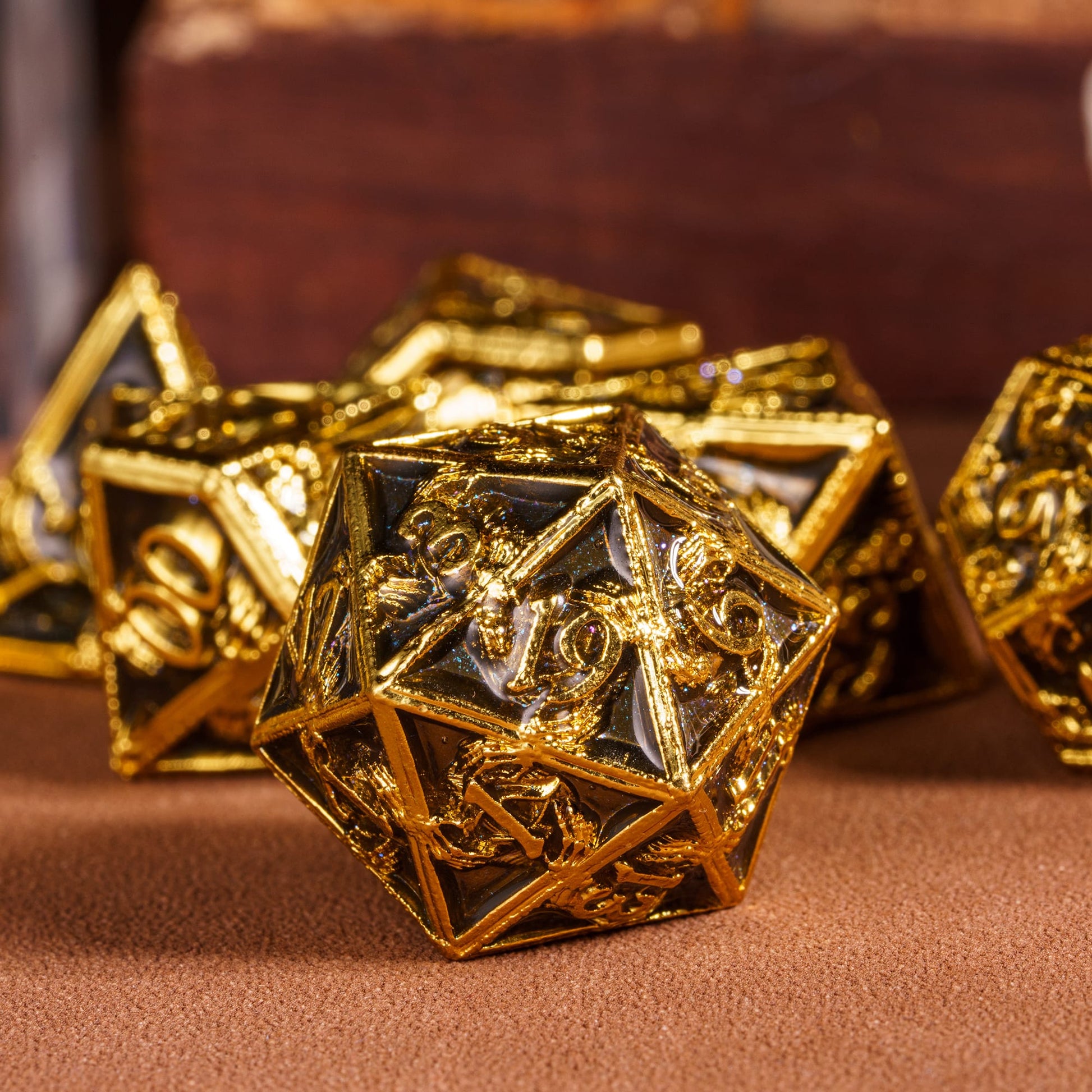 Onyx Crypt Metal Dice Set closeup of black & gold D20 die for tabletop roleplaying games