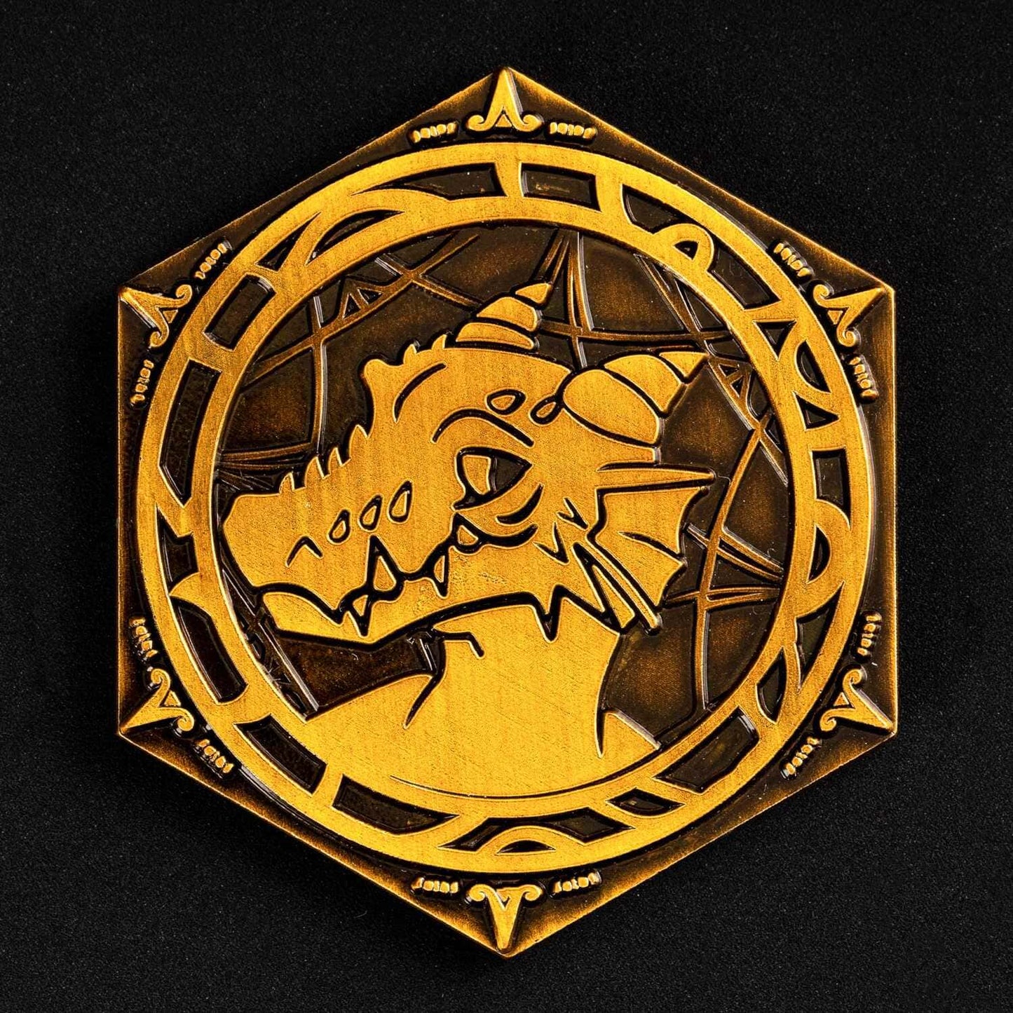 Close up of kobold side on gold metal Pack Tactics inspiration coin