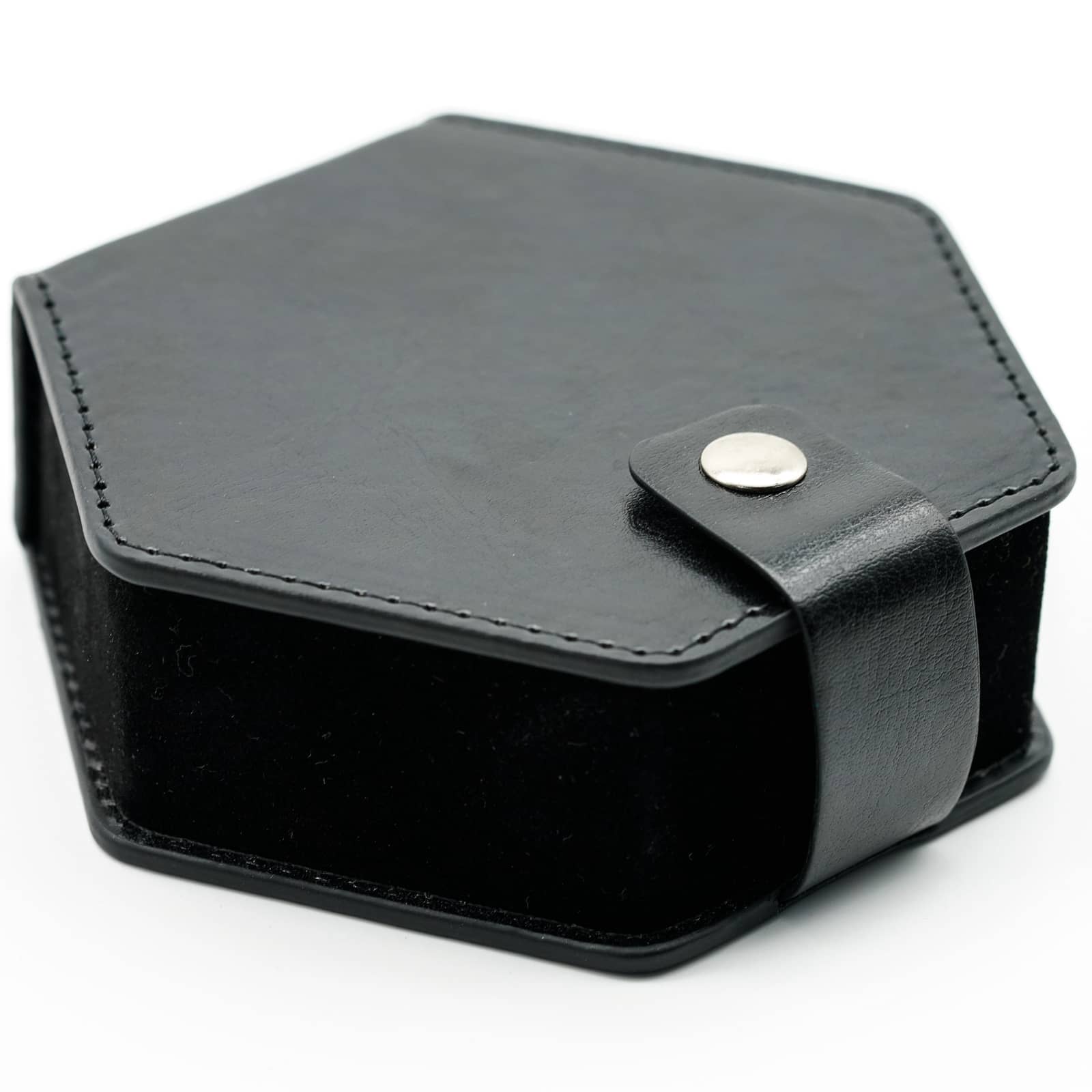 Compact black hexagon dice case closed with snap-button strap