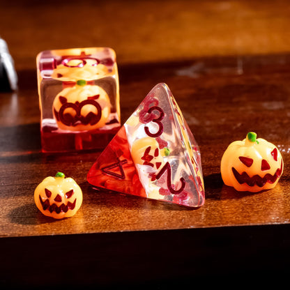 Pumpkin Lantern dice set D4 close up with pumpkin inclusion in clear red resin