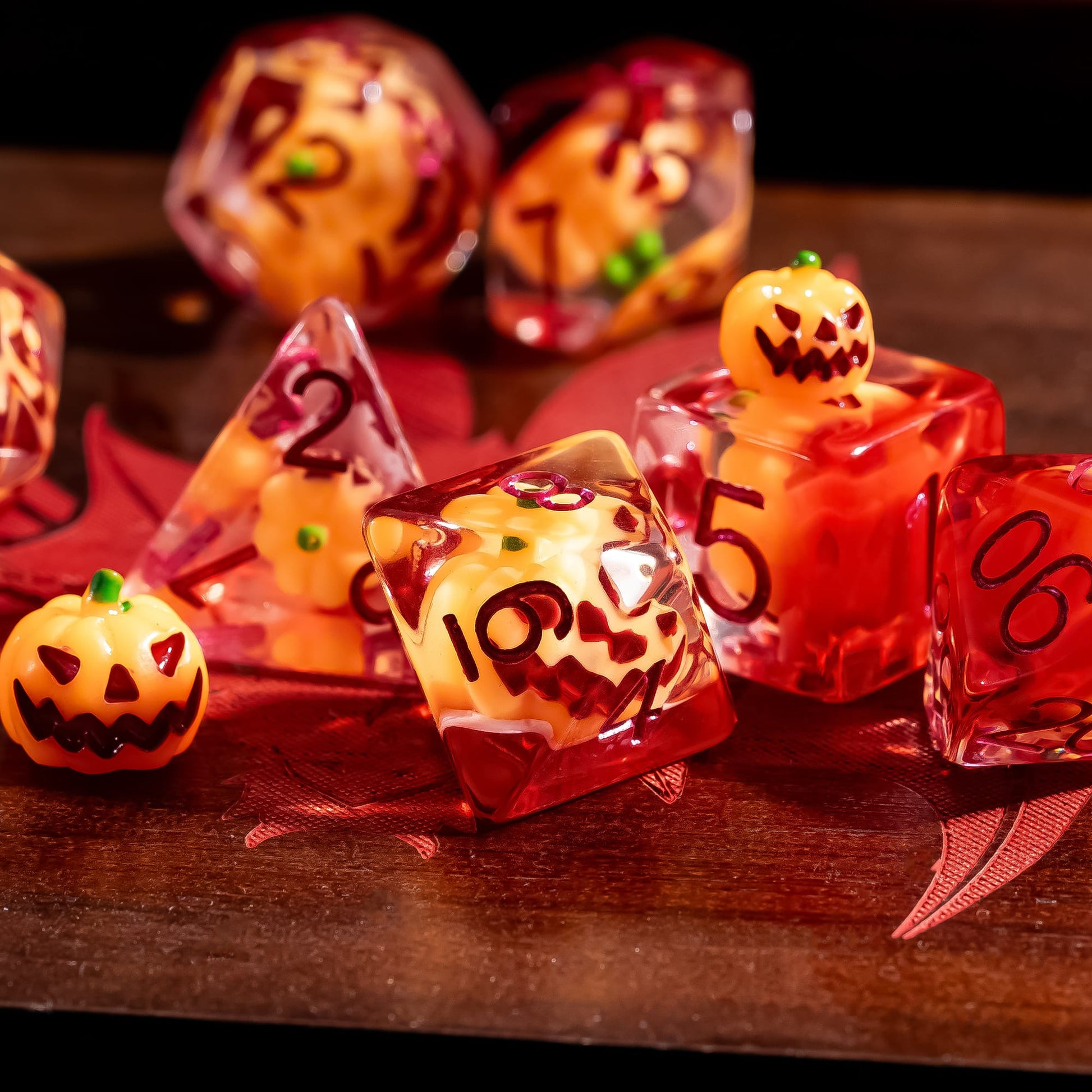 Pumpkin Lantern dice set displayed on wooden surface with pumpkin inclusions for tabletop RPGs