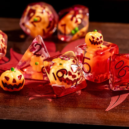Pumpkin Lantern dice set displayed on wooden surface with pumpkin inclusions for tabletop RPGs