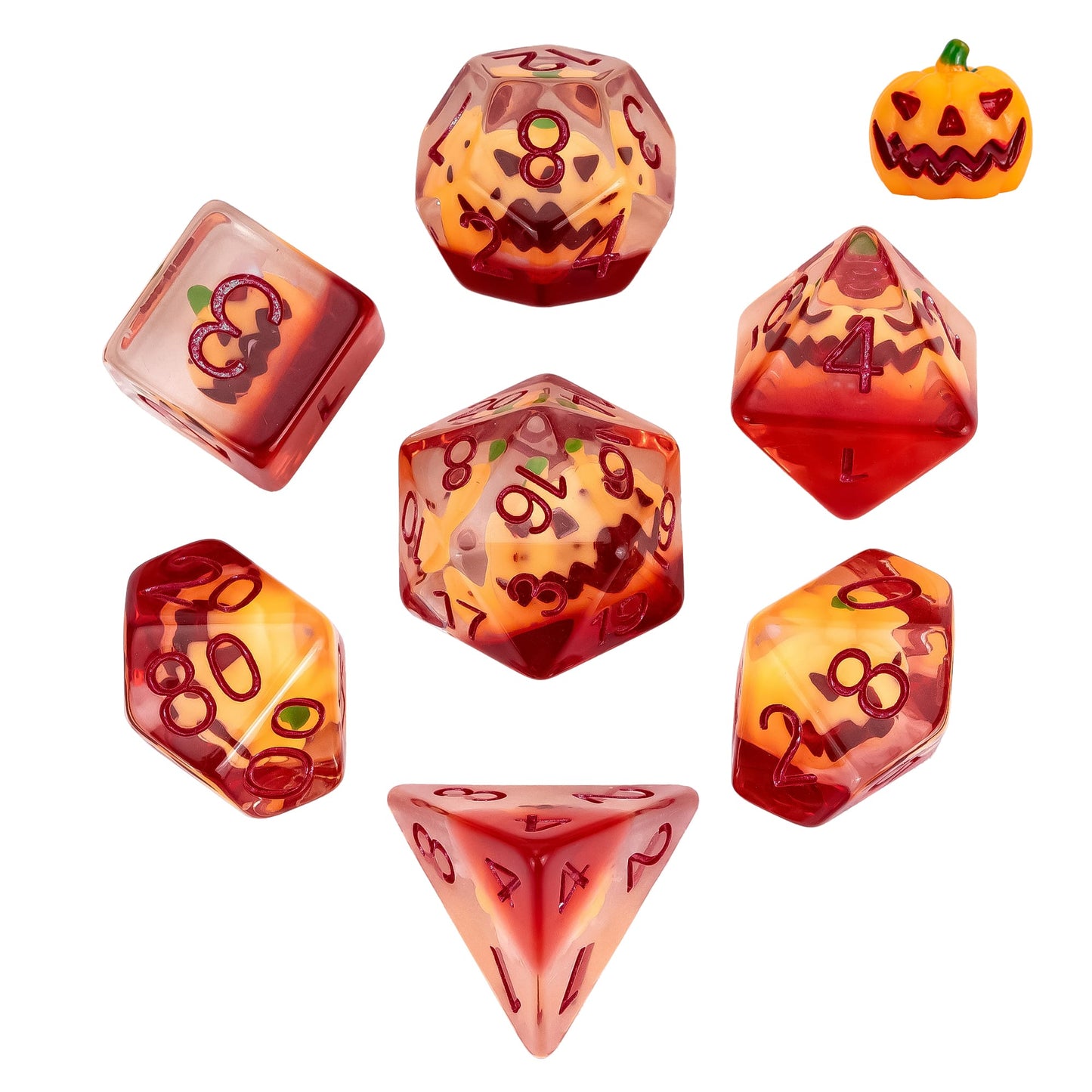 Flat lay of Pumpkin Lantern dice set 7 piece resin dice collection for DnD and DnD 5e