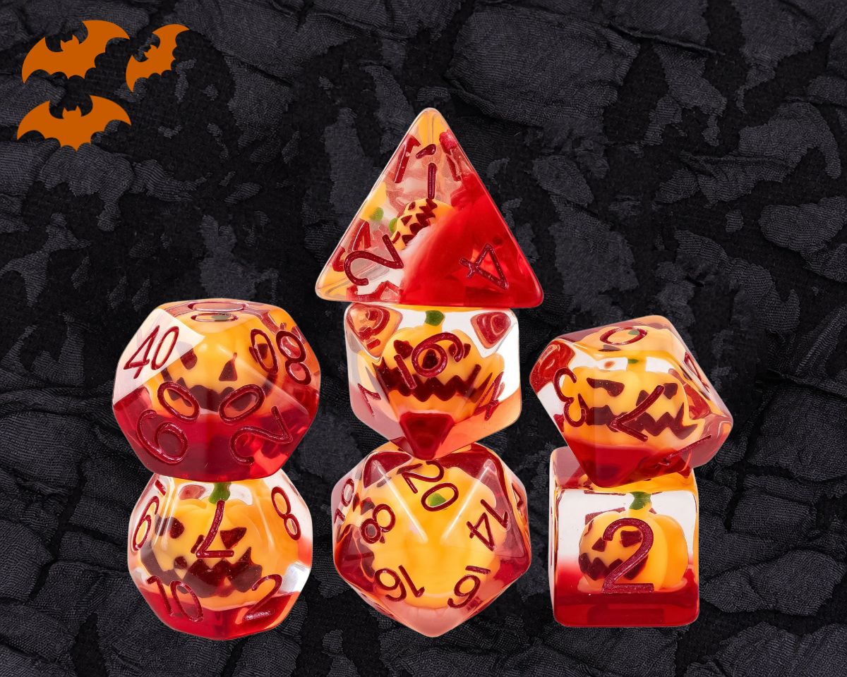 Pumpkin Lantern DnD dice set in orange and red resin with jack-o-lantern pumpkins inside