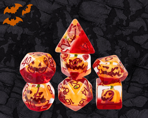Pumpkin Lantern DnD dice set in orange and red resin with jack-o-lantern pumpkins inside