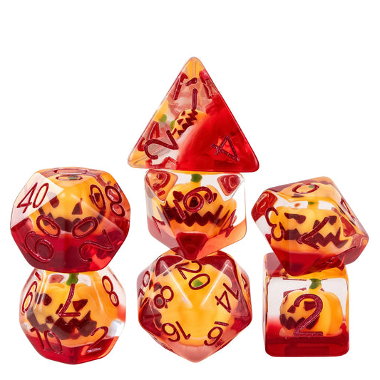 Stacked Pumpkin Lantern dice set featuring pumpkin inclusions suspended in red and clear resin with metallic red numbering for Dnd