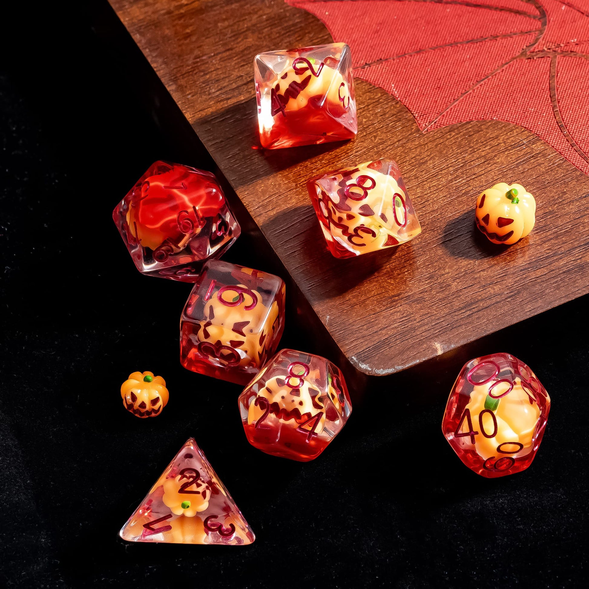 Top view of Pumpkin Lantern dice set with pumpkin inclusions for DnD and tabletop RPGs