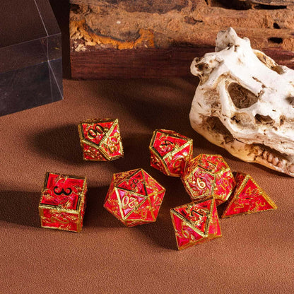 Royal Crypt Metal Dice Set red & gold RPG dice displayed on tabletop with skull
