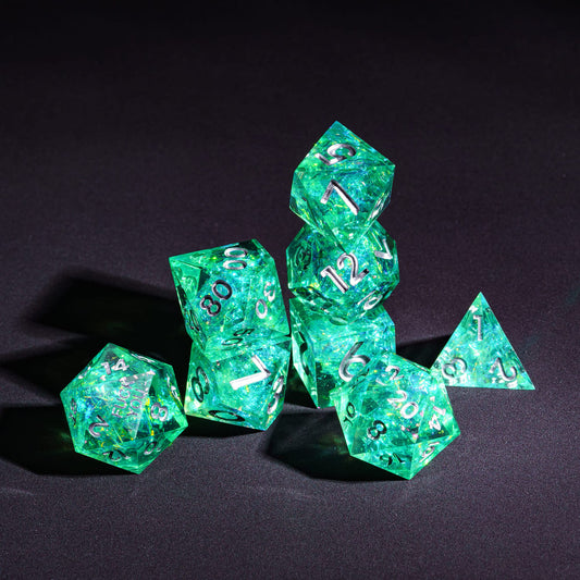 Stacked display of Sages Emerald F*ck Me Sharp Edge Dice Set showing 7 polyhedral dice for Dungeons & Dragons